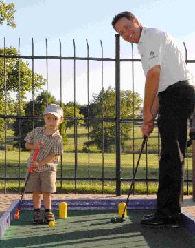 Ted and Sam Purdy enjoy a father-son golf outing.