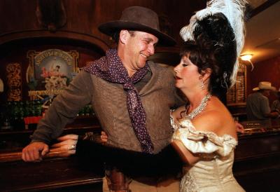One of the ladies at the Grand Hotel/Saloon, and an entertainer in the 